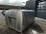 A silver-colored horizontal insulated stainless steel tank, with a capacity of 6500 liters, situated outdoors.